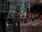 People arrive at Barcelona airport, Spain, Monday, June 7, 2021. Spain is trying to ramp up its tourism industry by welcoming from Monday vaccinated visitors from most countries, as well as all Europeans who prove that they are not infected with the coronavirus. (AP Photo/Emilio Morenatti)