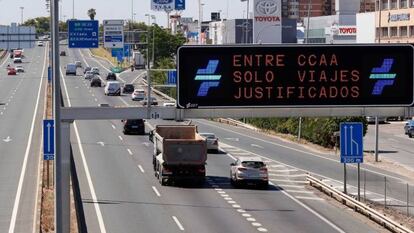 “Only justified travel allowed between regions,” reads this sign on the S30 highway to Seville on Monday.