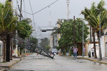 People survey the damage caused by the storm in Progreso, Yucatan State, on July 5.