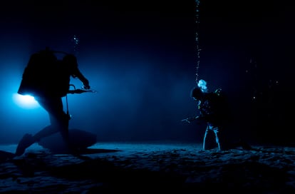 A NASA astronaut trains underwater. 