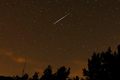 In this long exposure photo, a streak appears in the sky during the annual Perseid meteor shower at the Guadarrama mountains, near Madrid, in the early hours of Aug. 12, 2016. The best viewing for the annual shower visible around the world will be from Saturday night, Aug. 12, 2023