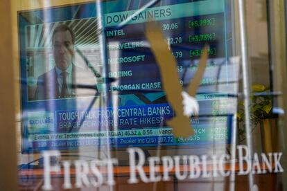 A television screen displaying financial news is seen inside one of First Republic Bank's branches in the Financial District of Manhattan, on March 16, 2023.