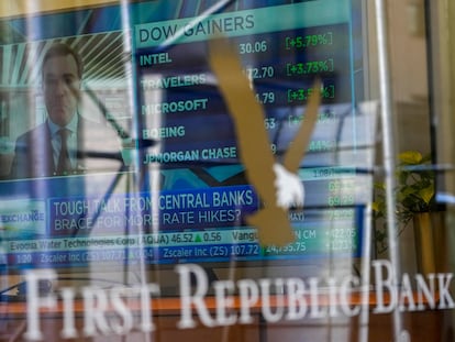 A television screen displaying financial news is seen inside one of First Republic Bank's branches in the Financial District of Manhattan, on March 16, 2023.