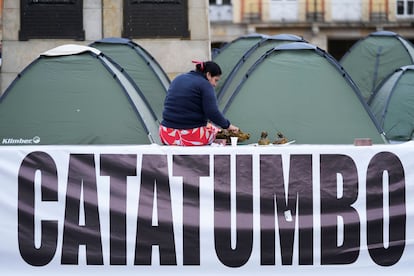 Marta Meneses, from the Catatumbo coca-growing region, has breakfast at Bolivar Square where she and others from her area are camping out in Bogota, Colombia, after traveling to the capital to request a meeting with President Gustavo Petro, Wednesday, Jan. 29, 2025
