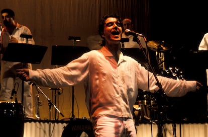 David Byrne Latin Band performs on stage, 1990.