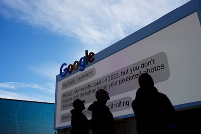 Workers help set up the Google booth at the Las Vegas Convention Center.