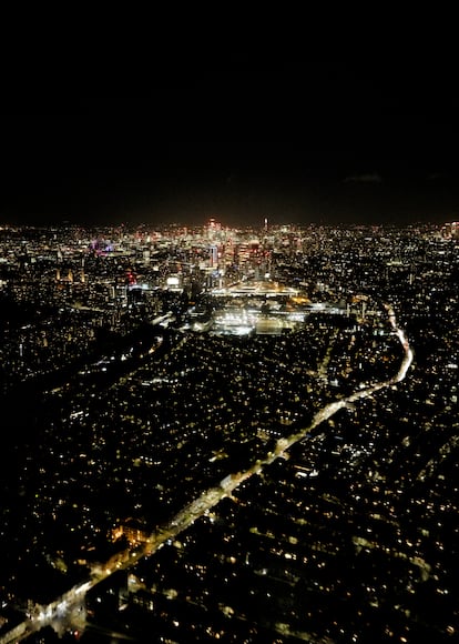 Night view of London from a helicopter.