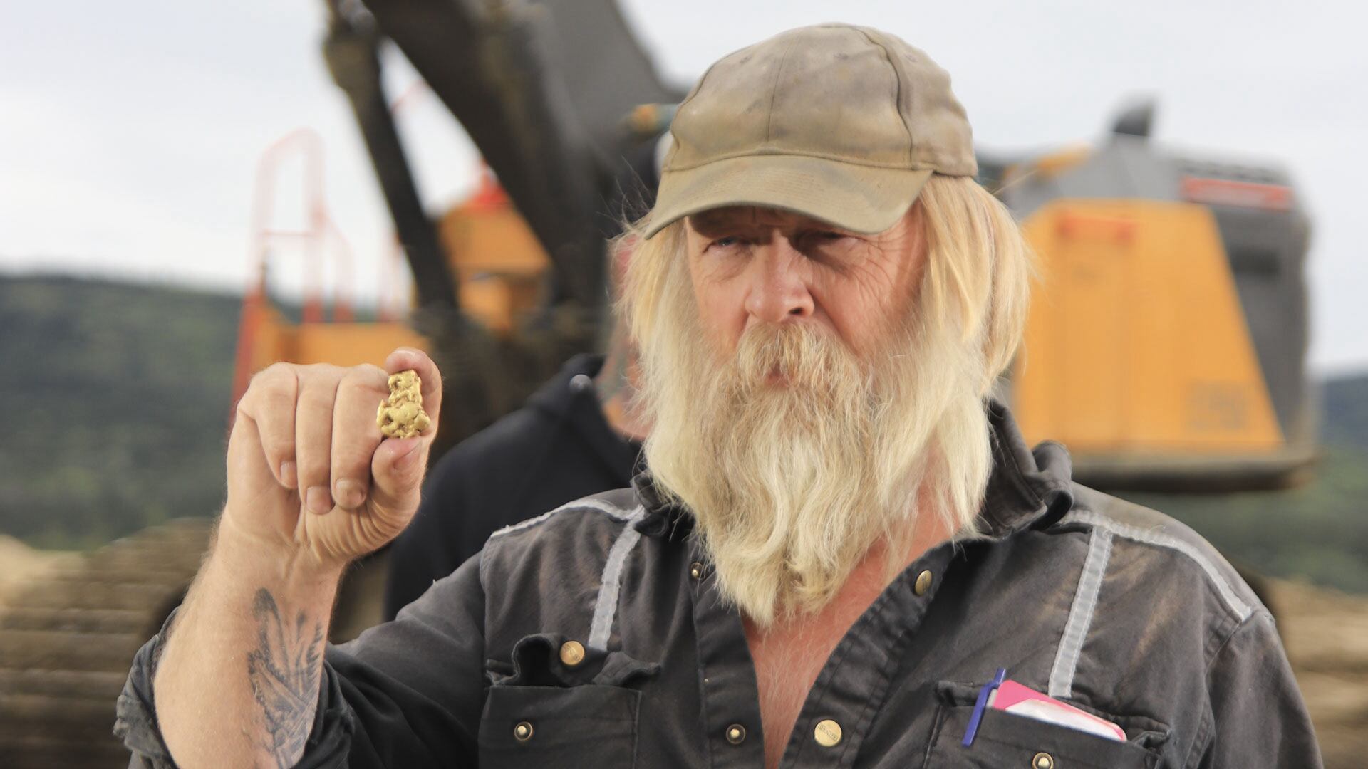 Tony holding gold nugget.