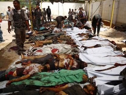 V&iacute;ctimas del bombardeo contra el mercado de Duma, un suburbio de Damasco
 