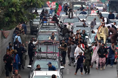 A convey of former Prime Minister Imran Khan drive toward Islamabad at a road in Lahore, Pakistan, Saturday, March 18, 2023.