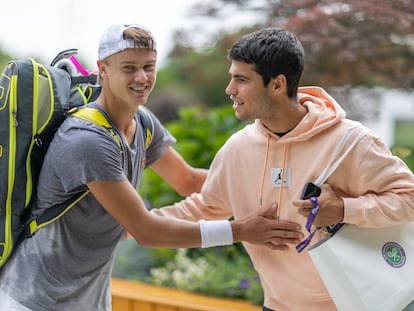 Holger Rune and Carlos Alcaraz greet each other before the start of Wimbledon at the All England Club.