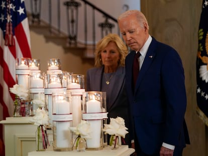 President Joe Biden, along with first lady Jill Biden, pauses at a memorial display before speaking on the one-year anniversary of the school shooting in Uvalde, Texas, at the White House, on May 24, 2023.