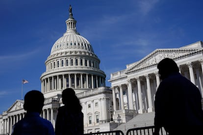 People walk outside the US Capitol building in Washington on June 9, 2022.