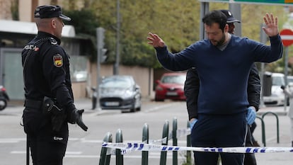 National Police officers in Madrid frisking a man who violated stay-at-home orders on March 24.