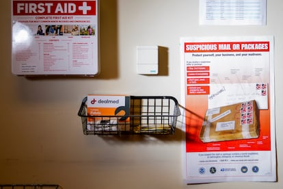 A United States Postal Service flyer about suspicious mail or packages is seen in the mail room at the King County Elections headquarters, Friday, Nov. 17, 2023, in Renton, Wash.