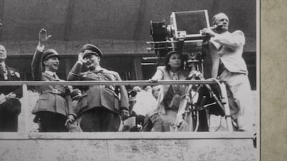 Leni Riefenstahl, behind the camera, during the filming of 'Olympia' with Joseph Goebbels (left) and Hermann Göring, in 1936.