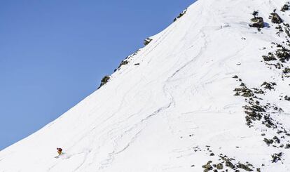 A skier practices 'freeride' on the slopes of Ordino-Arcalís ski resort.