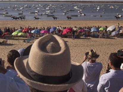 Glamor and poverty collide during horse racing carnival in southern Spanish town of Sanlúcar de Barrameda