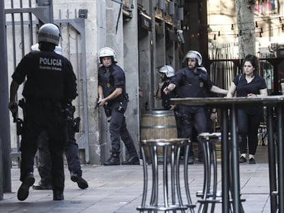 Police clear central Barcelona on Thursday afternoon.