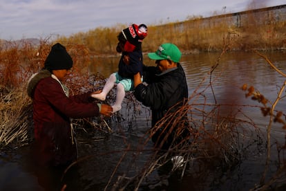 Monse, a 2-year-old Honduran migrant girl, is carried by her parents as they cross the Rio Bravo river to reach the United States and request asylum, as seen from Ciudad Juarez, Mexico February 1, 2024
