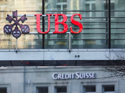 Logos of Swiss banks UBS and Credit Suisse are seen in Zurich, Switzerland, on March 20, 2023.