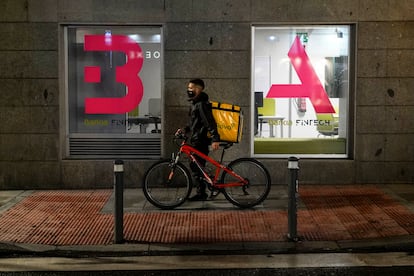 Food delivery rider Gianfranco in Madrid on the first night of the curfew rules.