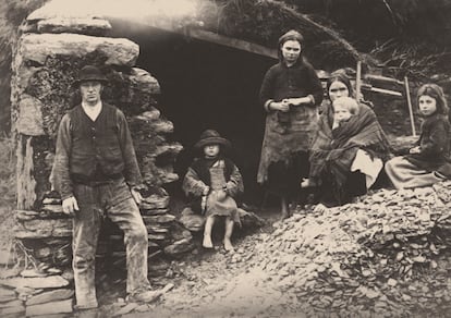 An Irish family in front of their home in Killarney during the Great Potato Famine.