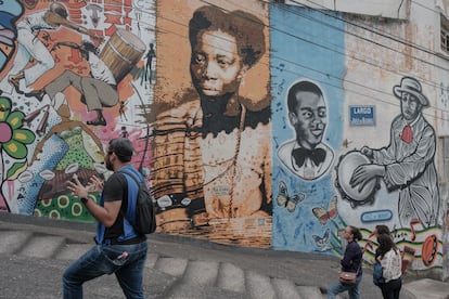 An African Heritage Walking Tour guide, explains the history of the Sun Stone in Rio de Janeiro