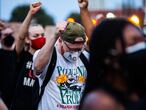 CHICAGO, ILLINOIS - SEPTEMBER 23: Protesters raise their fists during a rally in support of Breonna Taylor September 23, 2020 in Chicago, Illinois. Across the country, protesters have taken to the streets after the grand jury�s decision to only charge one Louisville Metro Police officer in the raid in which Taylor was killed. Officer Brett Hankison, who was fired in June, was charged three counts of wanton endangerment for shooting into neighboring apartments. Bond was set at $15,000 for Hankison. Taylor, a 26-year-old emergency medical technician, was killed in her home during a no-knock raid on March 13, 2020.   Natasha Moustache/Getty Images/AFP
== FOR NEWSPAPERS, INTERNET, TELCOS & TELEVISION USE ONLY ==