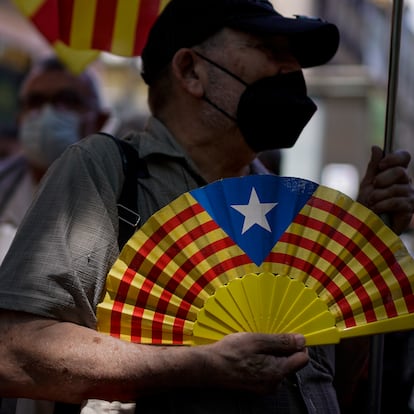 A pro-independence demonstrator attends a protest against Spain's prime minister Pedro Sanchez outside the Gran Teatre del Liceu in Barcelona, Spain, Monday, June 21, 2021. Sanchez's said Monday that the Spanish Cabinet will approve pardons for nine separatist Catalan politicians and activists imprisoned for their roles in the 2017 push to break away from Spain. (AP Photo/Joan Mateu)