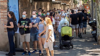 People waiting in line to get vaccinated outside Sant Pau Hospital in Barcelona.
