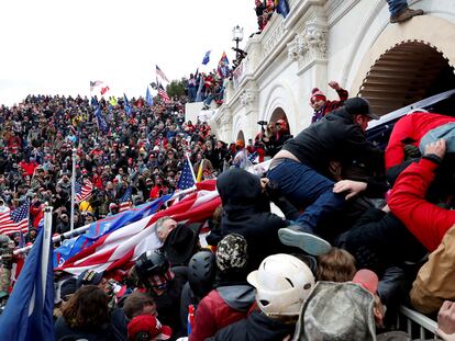 Donald Trump's supporters clash with police as they storm the Capitol on January 6, 2021.