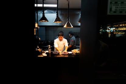 Micha Tsumura preparing a dish in his Maido restaurant in Lima, Peru.