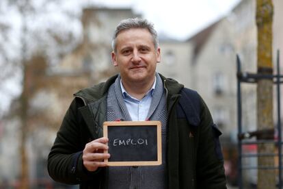 Richard Martinez, 40, holds a blackboard with the word "emploi" (employment), the most important election issue for him, as he poses for Reuters in Chartres, France February 1, 2017. He said: "The social climate is getting more and more difficult, even in developed countries in the western world." REUTERS/Stephane Mahe SEARCH "ELECTION CHARTRES" FOR THIS STORY. SEARCH "THE WIDER IMAGE" FOR ALL STORIES