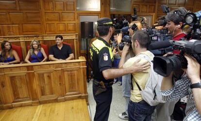 Television cameramen jostle for their angle at the council meeting in which Olvido Hormigos announced she would not be resigning 