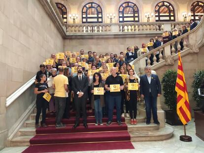 Pro-independence political parties stage a silent protest inside the Catalan Parliament.