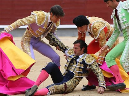 David Mora is tended to in the ring after his goring on Tuesday.