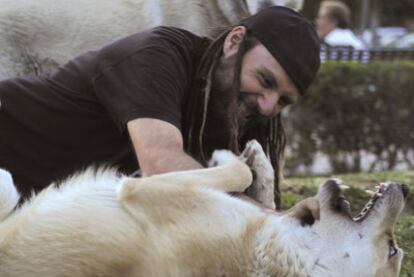 Pedro Martínez Collado plays with his dog before losing mobility due to Lou Gehrig's disease.