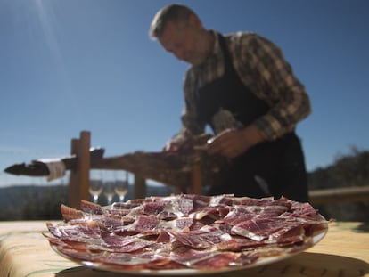 Eduardo Donato serves some of his prized ham.