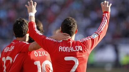 Real Madrid's Portuguese forward Cristiano Ronaldo (R) celebrates after scoring against Rayo Vallecano.