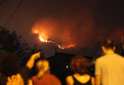 Flames rising above a church in Vigo.