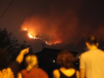 Flames rising above a church in Vigo.