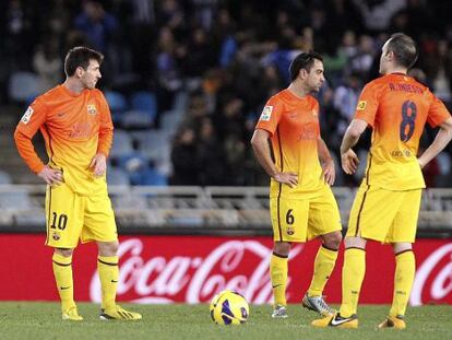 Messi, Xavi e Iniesta, cariacontecidos en Anoeta