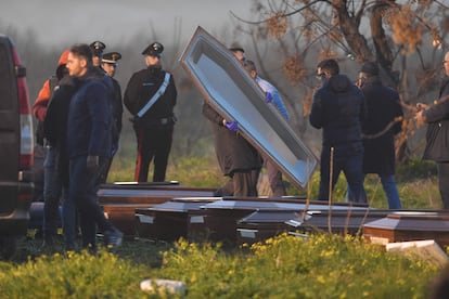 Employees of the local funeral home prepare coffins for the bodies of the migrants killed in the shipwreck in Calabria.