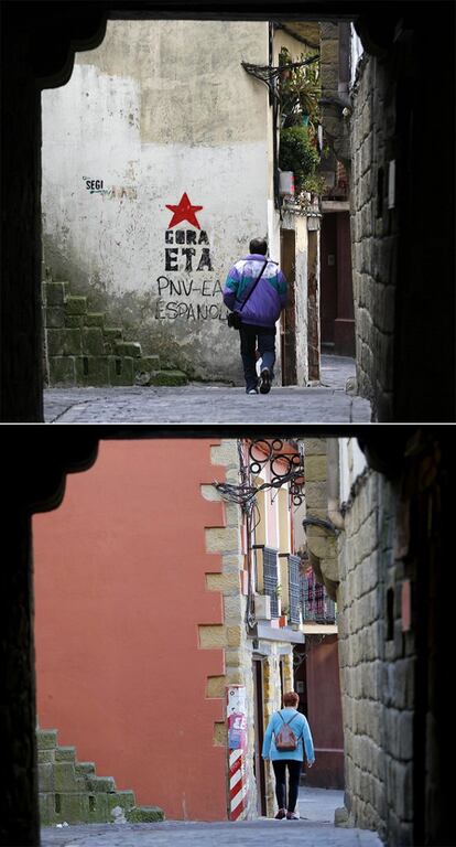 La calle Donibane en la localidad guipuzcoana de Pasaia, fotografiada con una pintada de enaltecimiento a ETA antes del cese definitivo de la banda (arriba) y en octubre de 2015.