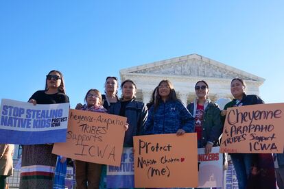 Demonstrators stand outside of the U.S. Supreme Court, as the court hears arguments over the Indian Child Welfare Act