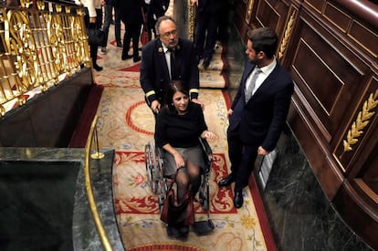 Adriana Lastra of the PSOE is taken out in a wheelchair after spraining her ankle.