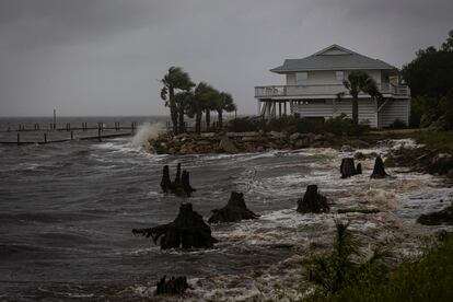 Waves impact a house seawall as Hurricane Helene intensifies before its expected landfall on Florida’s Big Bend, in Eastpoint, Florida, U.S. September 26, 2024.  