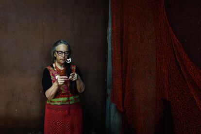 A weaver in the locker room of the National Stadium during the tribute.