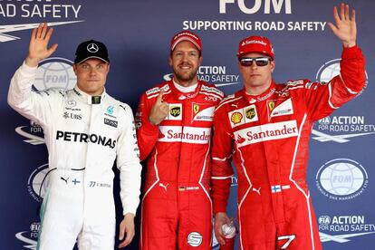 Vettel celebra la pole junto a Raikkonen y Bottas.